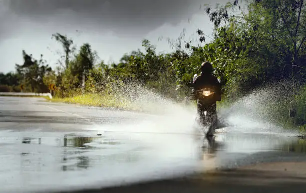 A bike driver driving in Rainy Season